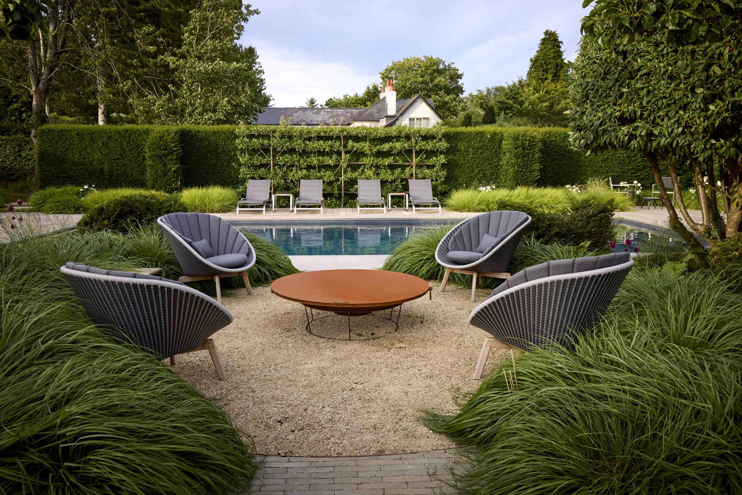 fire pit and lounge chairs